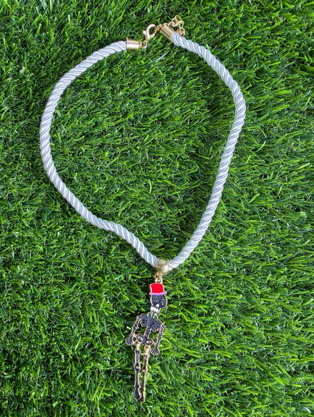 White Rope Necklace with Red-Hatted Skeleton Pendant